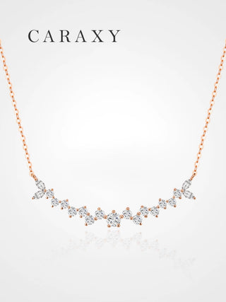 Leaf-inspired curved diamond necklace in 18K rose gold with 0.65 ct. tw. lab grown marquise and round brilliant diamonds.