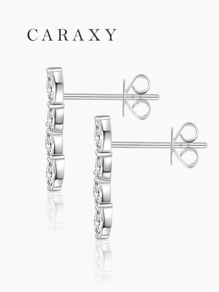 Side view of leaf-inspired diamond earrings with a slim drop silhouette and secure post backing.