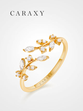 Angled view of a leaf lab grown diamond open wedding band in 18K yellow gold