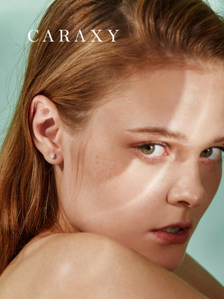 Model wearing minimal lab-grown diamond earrings in a close-up ear view.