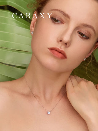 Close up model view of minimalist lab grown diamond solitaire necklace in 18K white gold with adjustable chain.