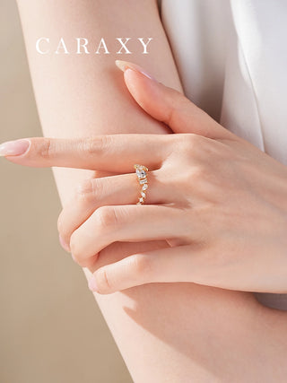 Mixed shape diamond ring on hand.