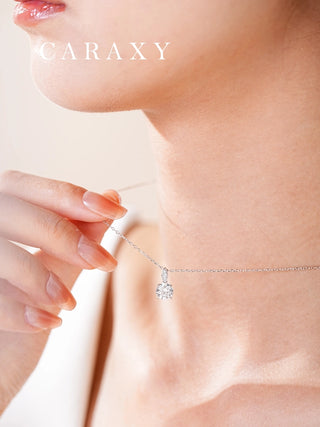 Model wearing an 18K white gold round lab-grown diamond solitaire necklace