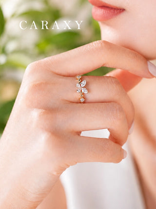 Model wearing an 18K yellow gold butterfly lab-grown diamond ring