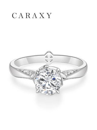Top view of a nature-inspired engagement ring with tapered pavé diamond accents.