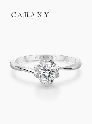 Top view of a nature-inspired floral solitaire ring with an elegant bypass band.