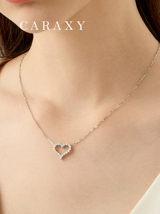 Model wearing an open heart diamond necklace, a romantic gift for her with delicate everyday sparkle.