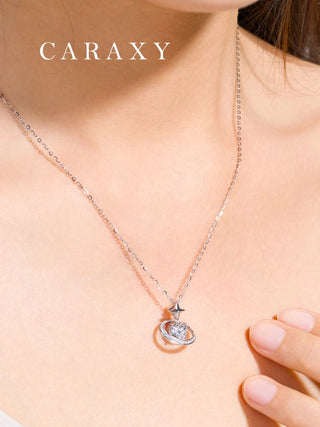 Close-up of a model wearing a celestial diamond necklace in 18K white gold with an orbit-like halo and 1 carat lab grown center stone.