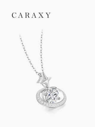 Angled view of a round diamond pendant necklace in 18K white gold with a celestial orbit-like halo and lab grown diamond center stone.