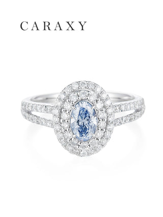 Top view of a stunning oval fancy blue diamond ring with a shimmering double halo.