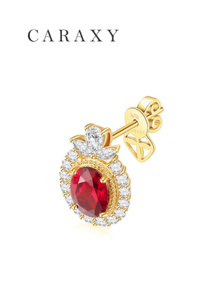 Oval ruby halo stud earring with butterfly push back in 18K yellow gold.