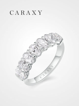 Angled view of an oval lab grown 7 stone diamond band in 18K white gold