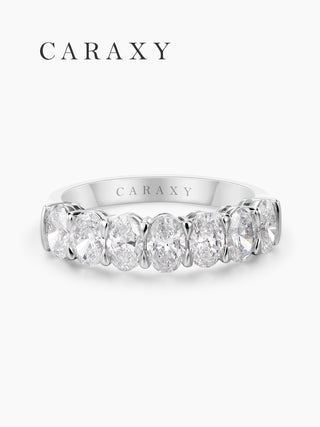 Front view of an oval lab grown 7 stone diamond band in 18K white gold