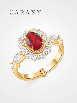Oval lab grown ruby and diamond halo engagement ring in 18K yellow gold