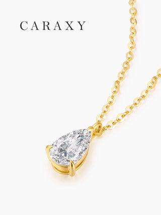 Side view of a pear shaped lab grown diamond solitaire pendant necklace in 18K yellow gold.