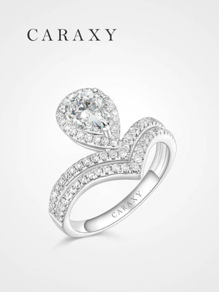 Pear halo engagement ring with a unique double chevron pavé band by CARAXY.