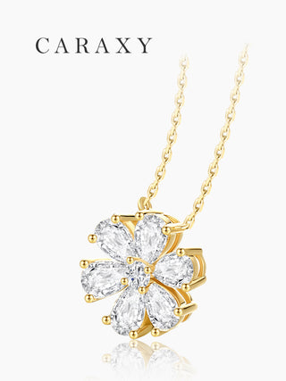Side view of a diamond flower pendant necklace in 18K yellow gold featuring pear-shaped petals and a delicate cluster silhouette.
