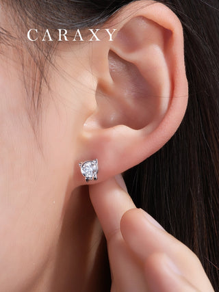Pet-inspired diamond earrings shown on model with soft natural styling.