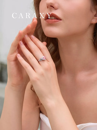 pink cushion-cut lab grown diamond ring worn on finger showing brilliant sparkle