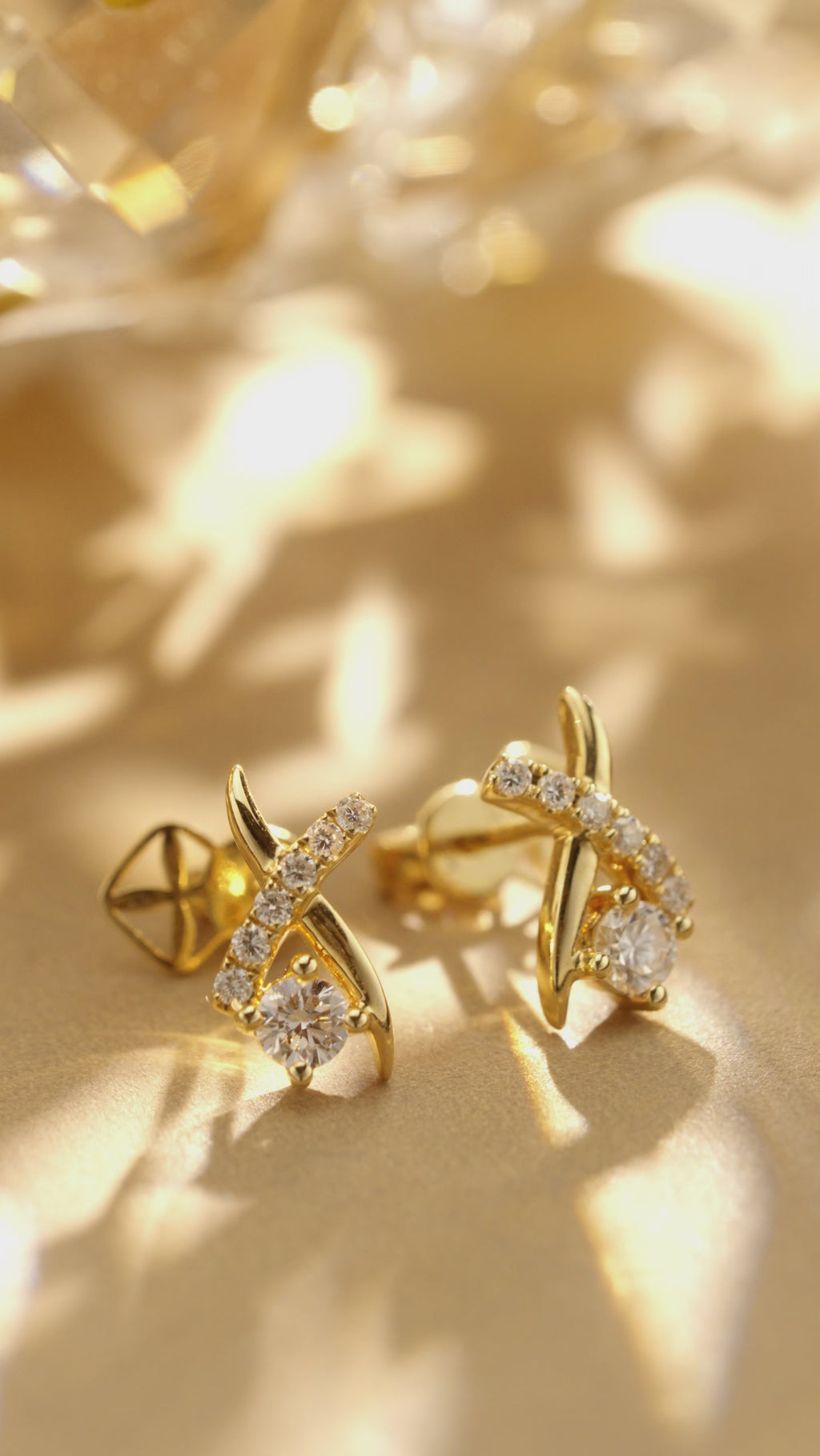 Vine-inspired lab grown diamond earrings in 18K yellow gold shown from multiple angles, highlighting the round diamonds and flowing vine design.