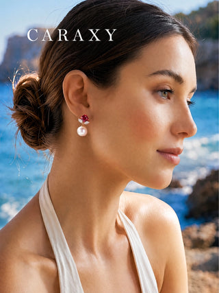 Woman wearing red gemstone diamond and pearl drop earrings in 18K yellow gold