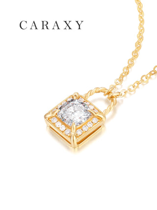 Angled view of a round brilliant lab grown diamond lock pendant necklace in 18K yellow gold with halo detailing and a rope-inspired bail.
