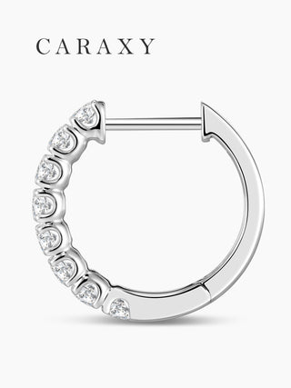 Side profile of round diamond hoop earrings with a polished 18K white gold finish