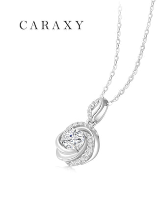 Angled view of round lab-grown diamond swirl pendant necklace with pavé accents
