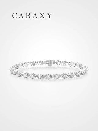 Front view of a round lab grown diamond X-link tennis bracelet in platinum.