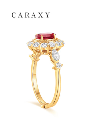 Side view of a lab grown ruby engagement ring with floral diamond halo and marquise side stones