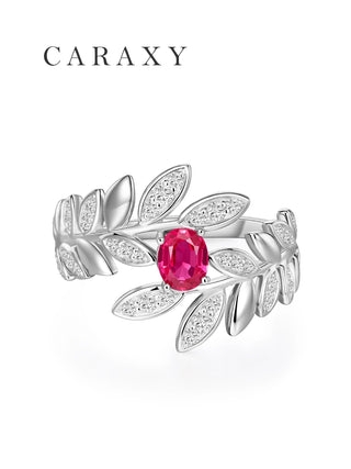 Front view of a ruby leaf bypass ring with lab grown diamond accents and botanical-inspired details.