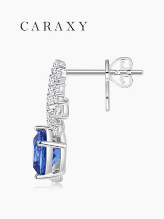 Side view of sapphire drop earrings with open gallery and push back.