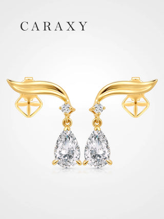 Sculptural pear drop lab grown diamond earrings in 18K yellow gold shown in a front view.