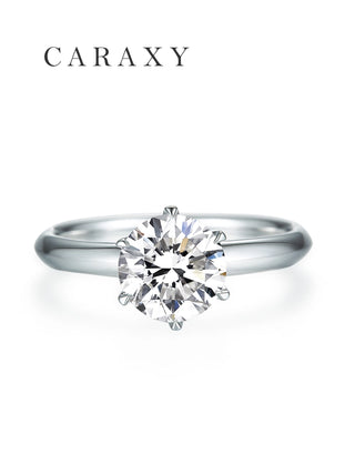 Top view of a classic six-prong solitaire ring with a sharp claw prong setting.