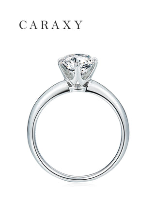 Side view of a knife edge solitaire ring showing the six-prong claw setting.