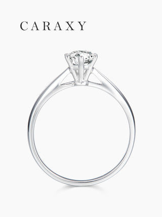 Side view of a six prong solitaire engagement ring showcasing the elegant cathedral setting.