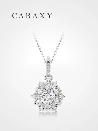 Snowflake-inspired lab grown diamond necklace in 18K white gold with a round brilliant center stone, halo design, and diamond bail.