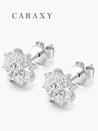 Model wearing snowflake diamond studs in a close-up ear view.