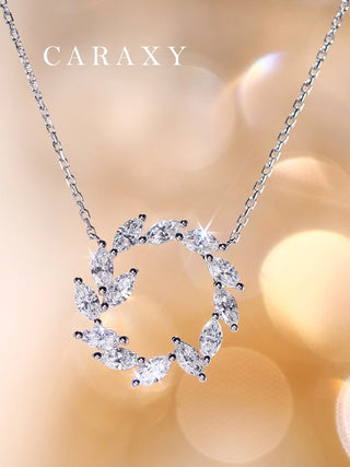 Sparkling leaf wreath diamond necklace in 18K white gold with marquise lab grown diamonds, lifestyle close-up.