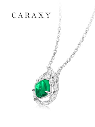 Side view of a sugarloaf emerald and diamond butterfly pendant in 18K white gold