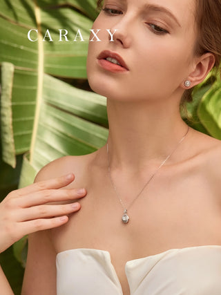 Model wearing a swirl lab-grown diamond pendant necklace with elegant white outfit