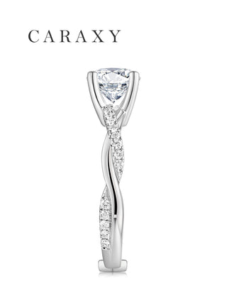 Side profile of a twist shank engagement ring with pavé-set diamonds and elevated solitaire setting