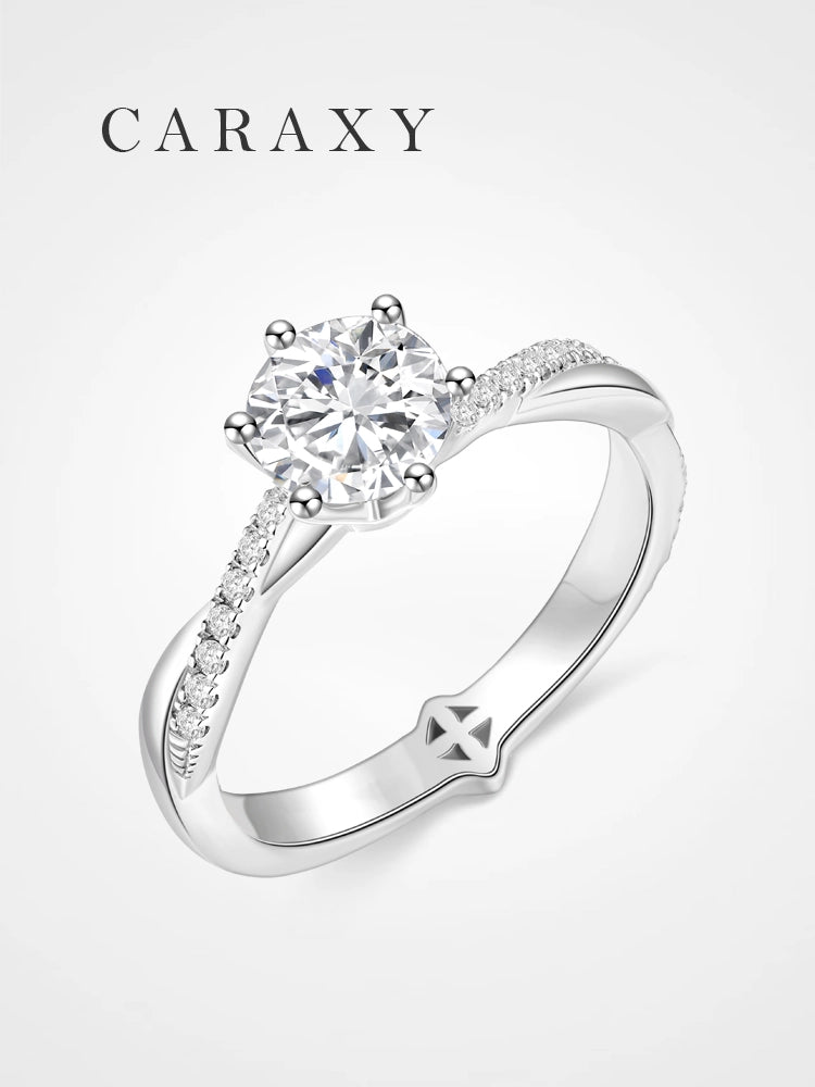 Twist shank engagement ring featuring a round lab-grown diamond in a six-prong setting.