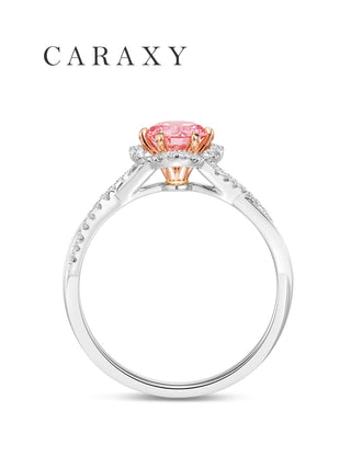 Side view of a pink diamond ring showcasing the intricate twisted pavé diamond band.