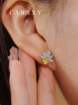 Unique bee-inspired stud earrings shown on model with soft natural styling.