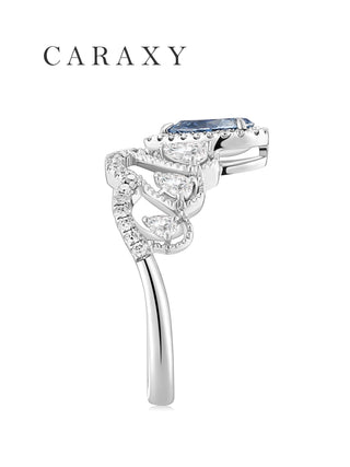 Side view of a unique blue diamond ring showcasing the intricate pavé band.