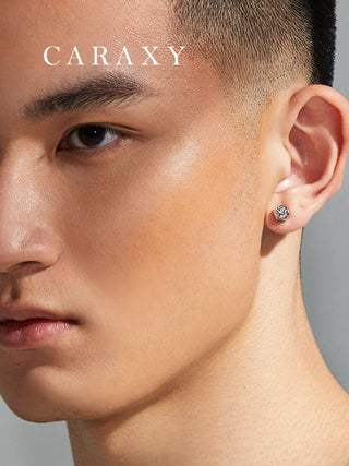 Unisex diamond studs shown on model with clean modern styling.