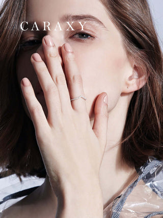 Woman wearing a V-shaped lab grown diamond wedding band in a lifestyle close-up