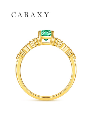Side view of vintage emerald ring in yellow gold.