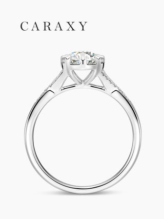 Side view of a vintage engagement ring showing the intricate floral-inspired setting.